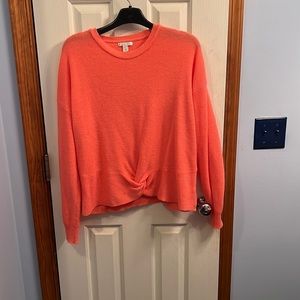 Large orange sweater…great with jeans!